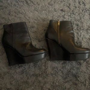 Black high wedge boots